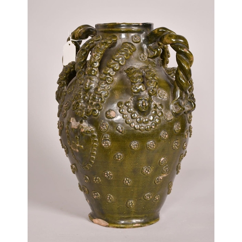 193 - Early 15th Century, a ceramic medieval vessel, scrolling handles and applied decoration, 14.5