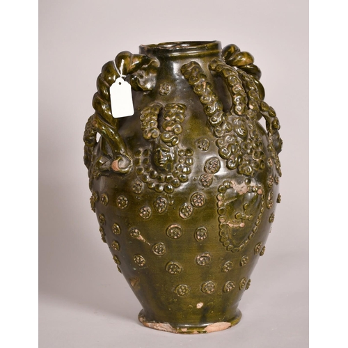 193 - Early 15th Century, a ceramic medieval vessel, scrolling handles and applied decoration, 14.5