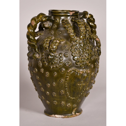 193 - Early 15th Century, a ceramic medieval vessel, scrolling handles and applied decoration, 14.5