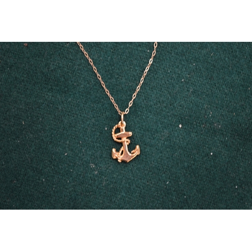 1003 - A 9ct gold chain with anchor pendant.