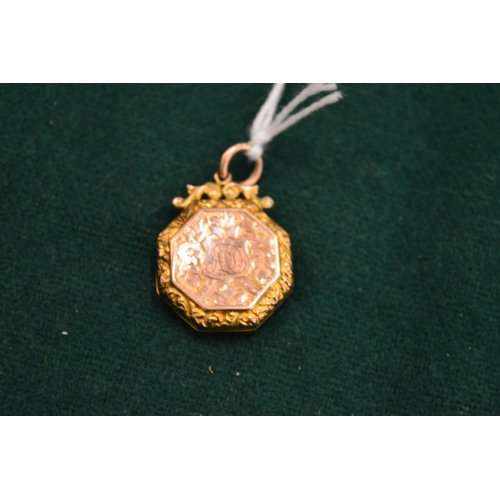 1008 - A 9ct gold engraved locket.