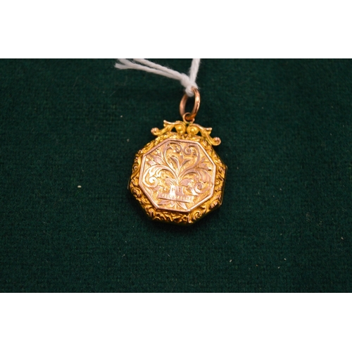 1008 - A 9ct gold engraved locket.