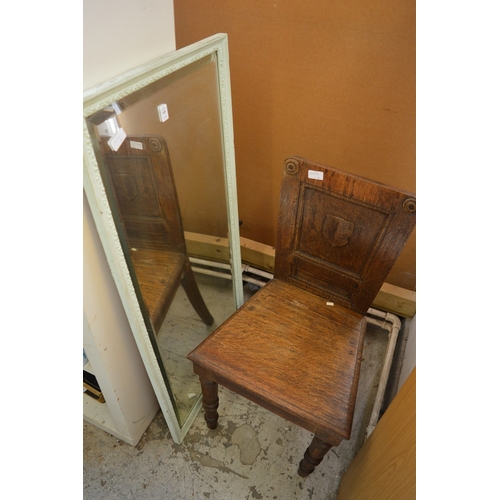 105 - A mirror and a chair.