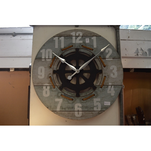 107 - A nautical themed wall clock.