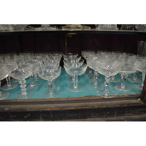 116 - A large quantity of cut glass drinking glasses.