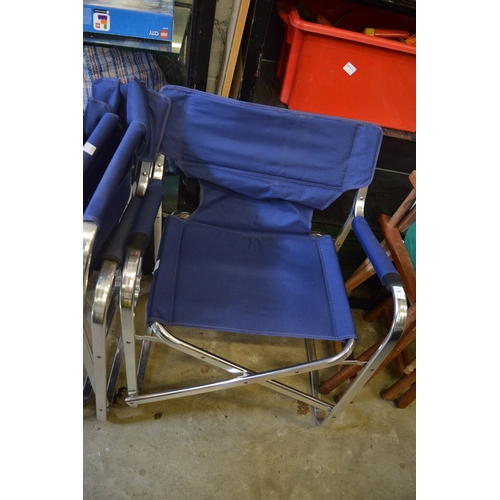 181 - A set of six aluminium and blue canvas folding directors style chairs.