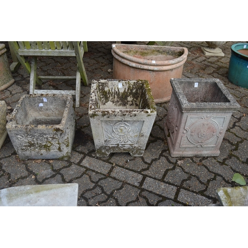 19 - Three reconstituted stone square shaped planters.