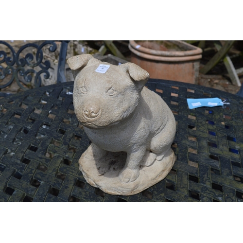 2 - A reconstituted stone model of a dog.