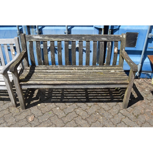 39 - A wooden garden bench.