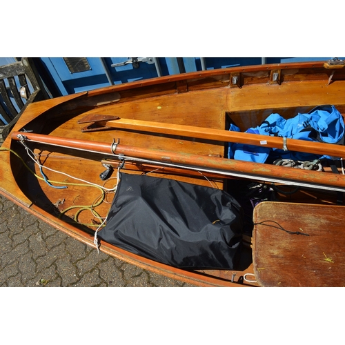 42 - A painted and varnished wooden sailing dingy with accessories.