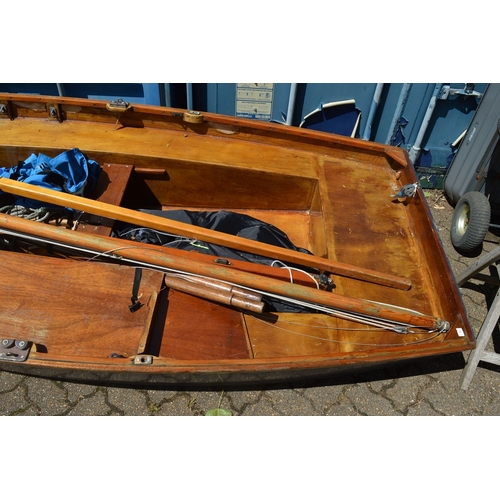 42 - A painted and varnished wooden sailing dingy with accessories.