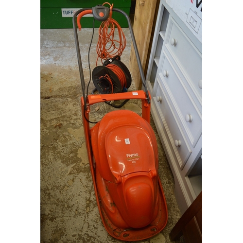 54 - A Flymo Hover Vac 280 electric lawn mower and a cable reel.