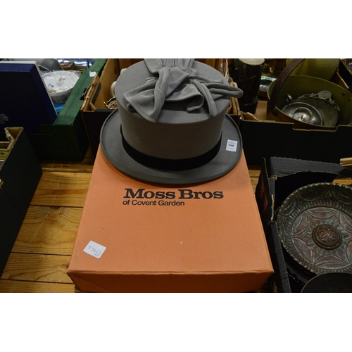 568 - A Moss Bros grey top hat size 7 3/8 together with a pair of gloves and original box.