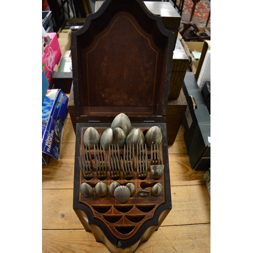 574 - A Georgian mahogany serpentine fronted cutlery box with contents.