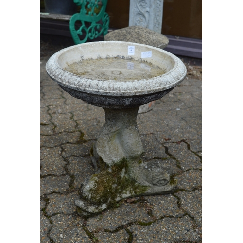 6 - Reconstituted stone bird bath with dolphin supports.