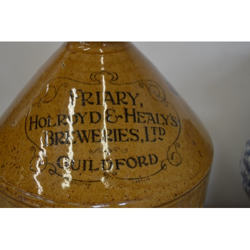 64 - Two stoneware flagons, one for Mealds & Cooper Wine Merchants, Guildford, the other for Friary, Holr... 