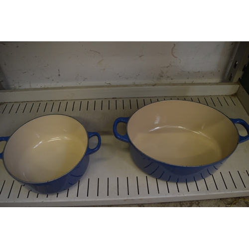 83 - Two Le Creuset blue enamel cast iron dishes with covers.