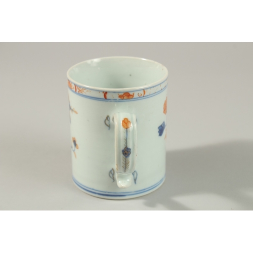 10 - A NANKING CARGO BLUE AND RED PORCELAIN TANKARD, together with a similar Nanking Cargo saucer dish, e... 