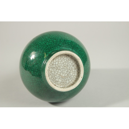 2 - A CHINESE GREEN CRACKLE GLAZE PORCELAIN BOTTLE VASE, 27cm high.