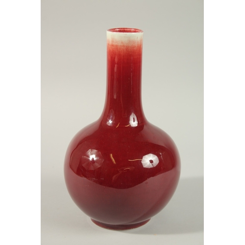 22 - A MID-20TH CENTURY CHINESE SANG DE BOEUF VASE, 29cm high.