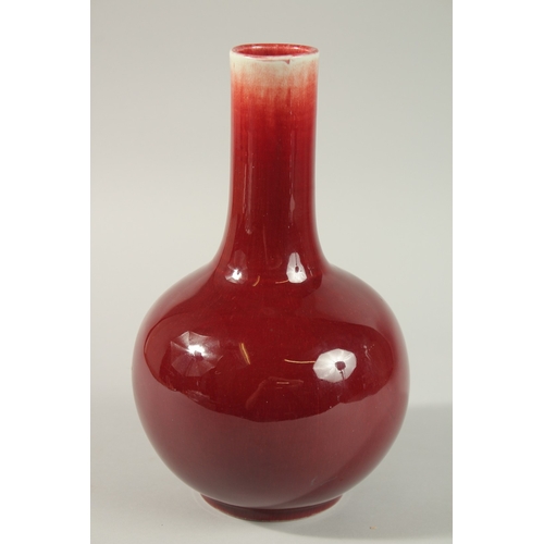 22 - A MID-20TH CENTURY CHINESE SANG DE BOEUF VASE, 29cm high.