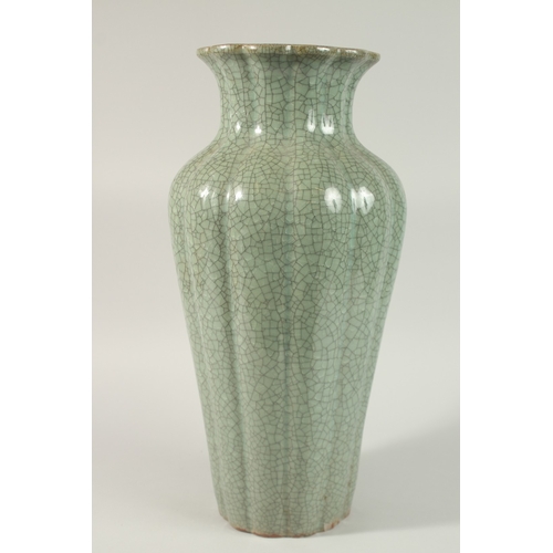 23 - A VERY LARGE CHINESE CELADON CRACKLE GLAZE PORCELAIN VASE, with lobed body and petal-form rim, 48cm ... 