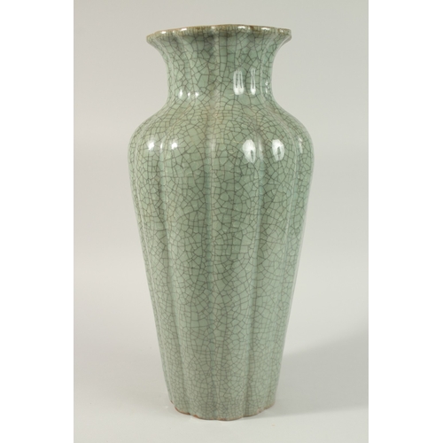 23 - A VERY LARGE CHINESE CELADON CRACKLE GLAZE PORCELAIN VASE, with lobed body and petal-form rim, 48cm ... 