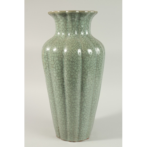 23 - A VERY LARGE CHINESE CELADON CRACKLE GLAZE PORCELAIN VASE, with lobed body and petal-form rim, 48cm ... 