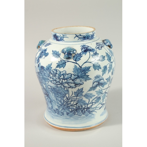 27 - A LARGE CHINESE BLUE AND WHITE PORCELAIN JAR, painted with exotic birds amongst flora, 25cm high.