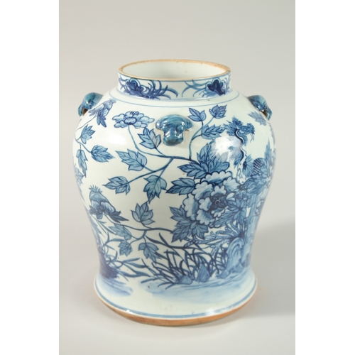 27 - A LARGE CHINESE BLUE AND WHITE PORCELAIN JAR, painted with exotic birds amongst flora, 25cm high.