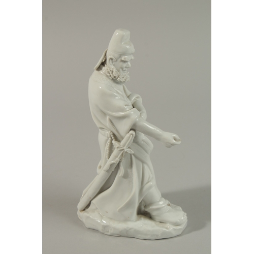 33 - A FINE BLANC-DE-CHINE FIGURE of a bearded man, 21cm high.