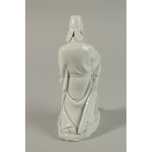 33 - A FINE BLANC-DE-CHINE FIGURE of a bearded man, 21cm high.