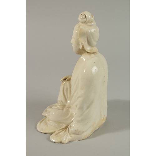 34 - A 17TH CENTURY BLANC-DE-CHINE SEATED FIGURE, 22cm high.