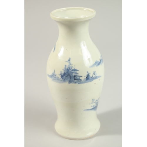 4 - A CHINESE BLUE AND WHITE PORCELAIN VASE, painted with figures feeding a bird, 21cm high.