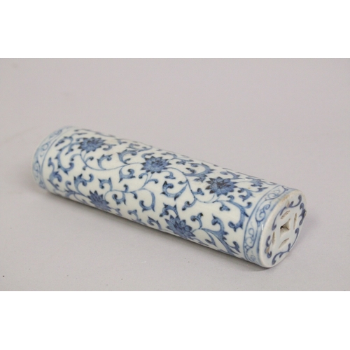A CHINESE BLUE AND WHITE PORCELAIN WRIST REST, with lotus decoration ...