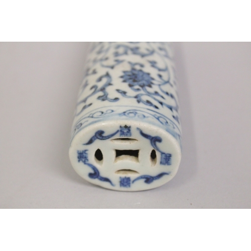 A CHINESE BLUE AND WHITE PORCELAIN WRIST REST, with lotus decoration ...
