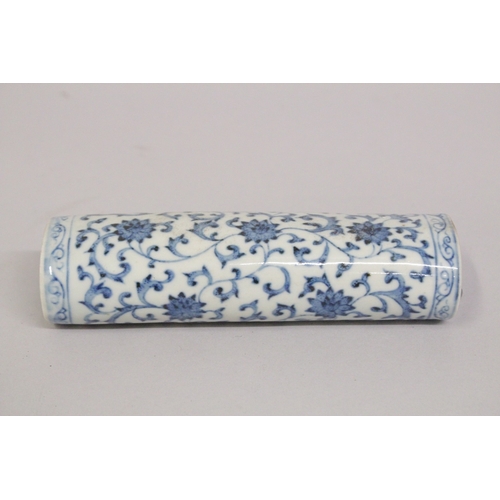 A CHINESE BLUE AND WHITE PORCELAIN WRIST REST, with lotus decoration ...