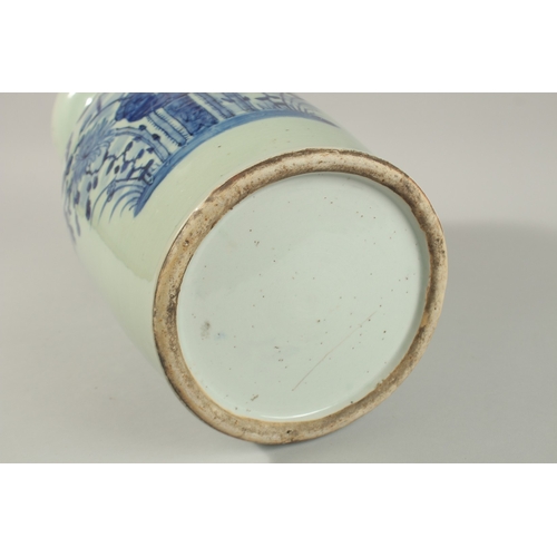 42 - A LARGE CHINESE PALE CELADON BLUE AND WHITE PORCELAIN VASE, painted with a spray of flora, the neck ... 