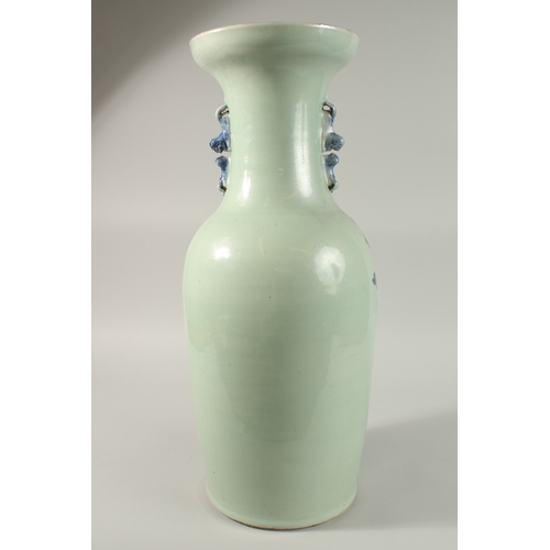 42 - A LARGE CHINESE PALE CELADON BLUE AND WHITE PORCELAIN VASE, painted with a spray of flora, the neck ... 