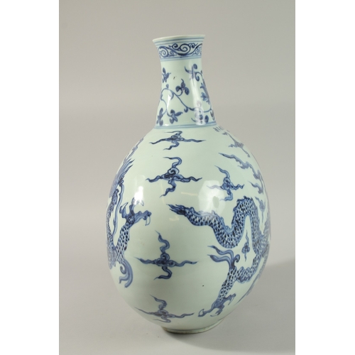 46 - A VERY LARGE CHINESE BLUE AND WHITE PORCELAIN DRAGON MOON FLASK VASE, 45cm high.