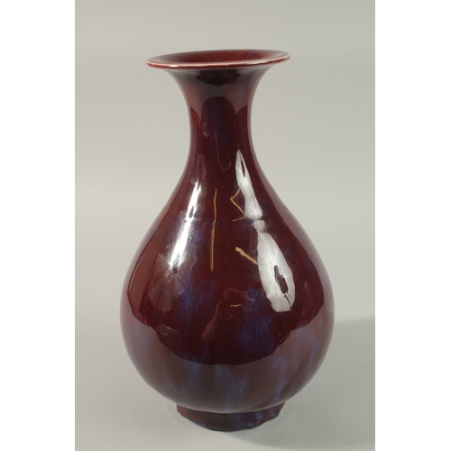 54 - A LARGE CHINESE FLAMBE GLAZED PORCELAIN VASE, 35cm high.