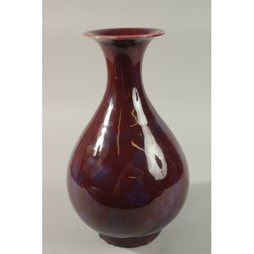 54 - A LARGE CHINESE FLAMBE GLAZED PORCELAIN VASE, 35cm high.