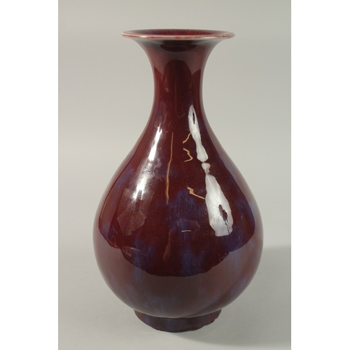 54 - A LARGE CHINESE FLAMBE GLAZED PORCELAIN VASE, 35cm high.