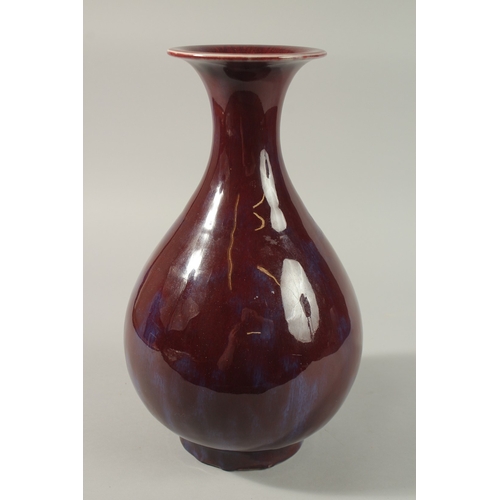 54 - A LARGE CHINESE FLAMBE GLAZED PORCELAIN VASE, 35cm high.