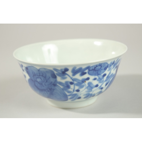 8 - A CHINESE BLUE AND WHITE PORCELAIN BOWL, with flower head decoration to exterior, the base with char... 