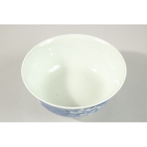 8 - A CHINESE BLUE AND WHITE PORCELAIN BOWL, with flower head decoration to exterior, the base with char... 