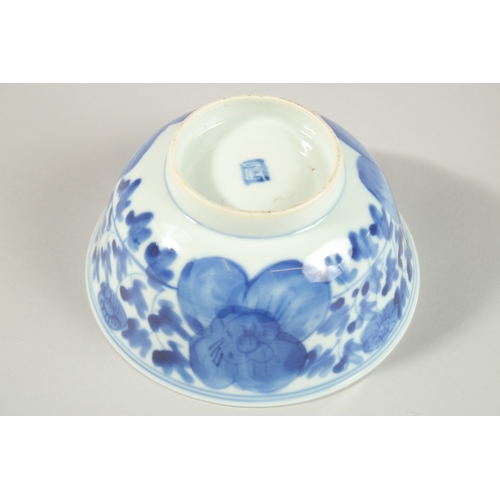 8 - A CHINESE BLUE AND WHITE PORCELAIN BOWL, with flower head decoration to exterior, the base with char... 