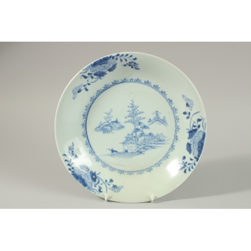 9 - A CHINESE NANKING CARGO BLUE AND WHITE PORCELAIN PLATE, decorated with a central panel of a woodland... 