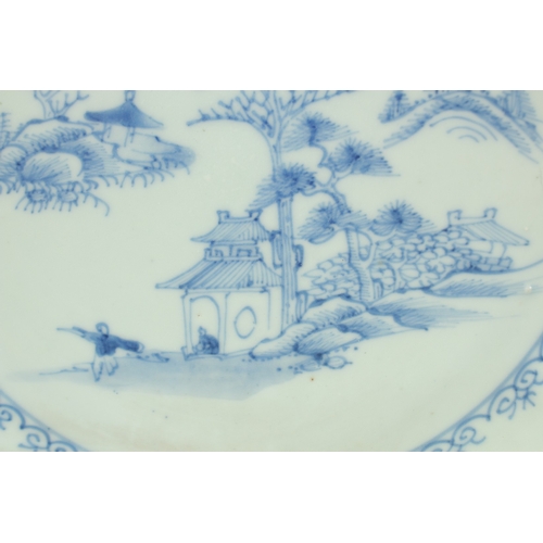 9 - A CHINESE NANKING CARGO BLUE AND WHITE PORCELAIN PLATE, decorated with a central panel of a woodland... 