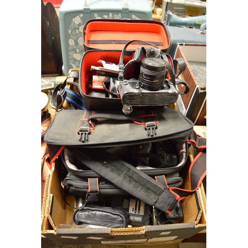 118 - Quantity of assorted cameras and accessories.